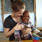 volunteer with kids in Tanzania