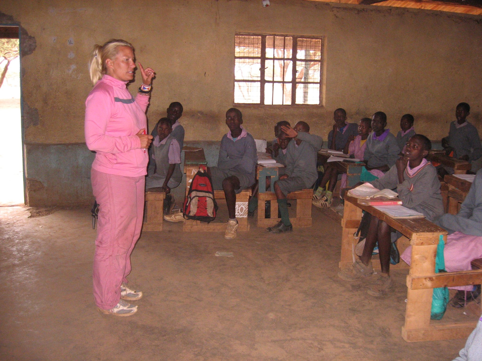 woman teaching kids in classroom